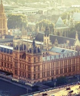 Aerial view of the Houses of Parliament and Big Ben along the River Thames in London. - Olive Oil Times