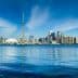 Panoramic view of Toronto skyline featuring the CN Tower and waterfront. - Olive Oil Times