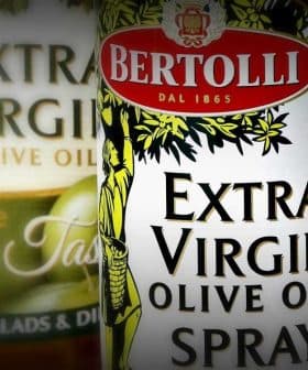 Three bottles of Bertolli Extra Virgin Olive Oil and Olive Oil Spray with distinct labels and designs. - Olive Oil Times