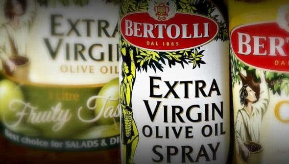 Three bottles of Bertolli Extra Virgin Olive Oil and Olive Oil Spray with distinct labels and designs. - Olive Oil Times