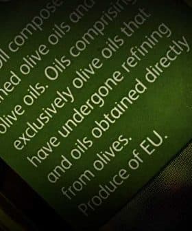 Close-up of an olive oil label detailing composition and origin of the oil. - Olive Oil Times