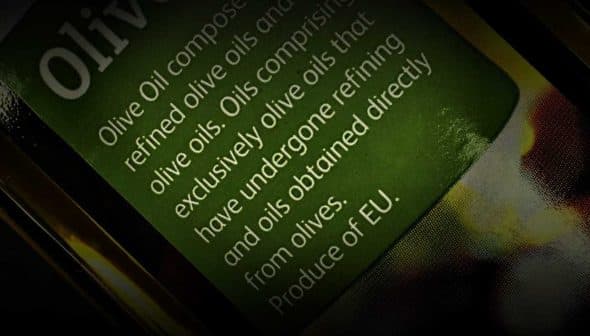 Close-up of an olive oil label detailing composition and origin of the oil. - Olive Oil Times
