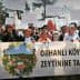 Group of protesters holding banners and signs during a demonstration in Orhanlı Village against a quarry operation. - Olive Oil Times