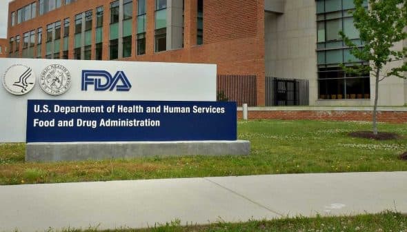 Sign for the U.S. Department of Health and Human Services Food and Drug Administration outside a building. - Olive Oil Times