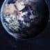 A detailed view of Earth from space, showing landmasses and oceans against a dark background. - Olive Oil Times