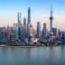 Panoramic view of the Shanghai skyline featuring modern skyscrapers and the Huangpu River. - Olive Oil Times