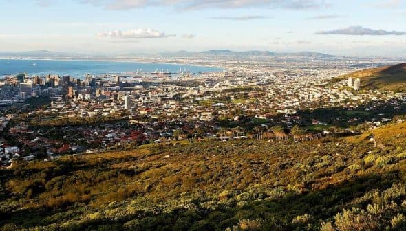 Aerial view of Cape Town with the coastline and mountains in the background. - Olive Oil Times