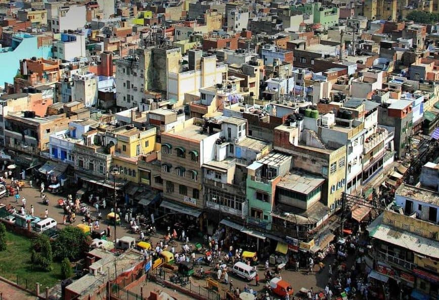 Aerial view of a densely populated urban area with various buildings and streets visible. - Olive Oil Times