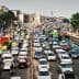 A congested urban street filled with various vehicles including cars, buses, and trucks during daytime. - Olive Oil Times