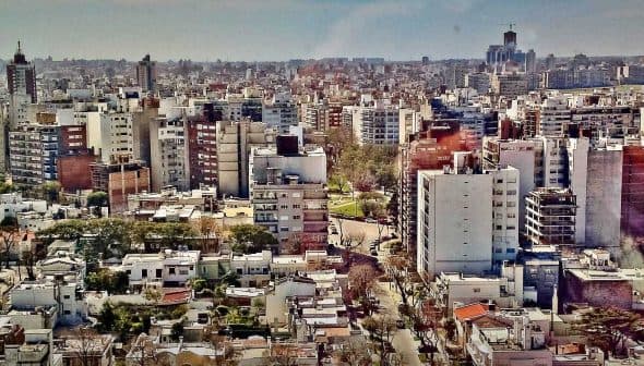Aerial view of a densely populated urban area in Buenos Aires with various buildings and structures. - Olive Oil Times
