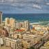 Panoramic view of a coastal city with buildings and the ocean in the background. - Olive Oil Times
