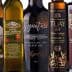 Assorted olive oil bottles displayed in a row with different labels and designs. - Olive Oil Times