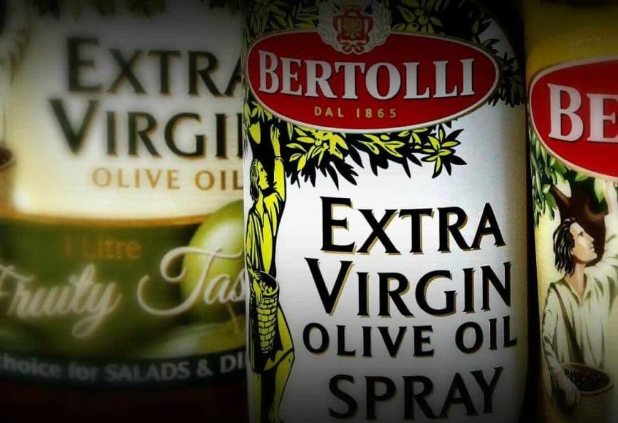 Three bottles of Bertolli extra virgin olive oil, including a spray option and fruity taste variant. - Olive Oil Times