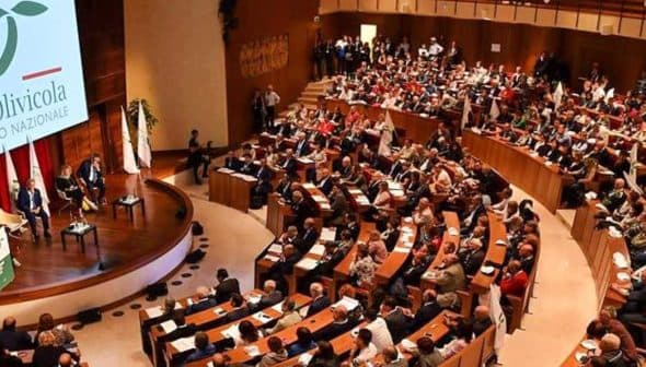 Interior view of a conference hall filled with attendees during an Italia Olivicola event. - Olive Oil Times