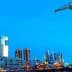 View of the Puerto Madero waterfront in Buenos Aires featuring modern buildings and a crane. - Olive Oil Times