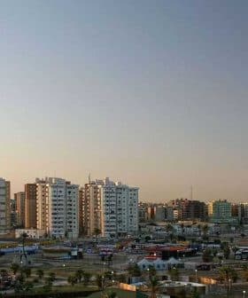 Panoramic view of Tripoli skyline featuring modern buildings and a clear sky. - Olive Oil Times