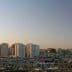 Panoramic view of Tripoli skyline featuring modern buildings and a clear sky. - Olive Oil Times