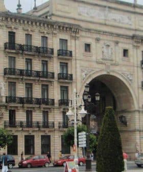Facade of the Banco Santander building featuring ornate architectural details and balconies. - Olive Oil Times