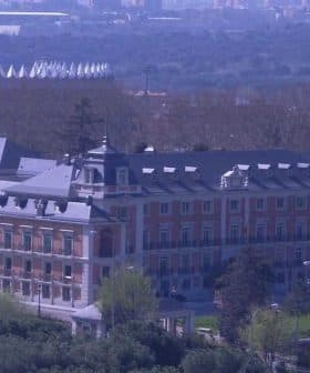 Moncloa Palace, a historical building in Madrid, Spain, surrounded by trees and greenery. - Olive Oil Times