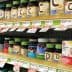 Various bottles of dietary supplements displayed on a store shelf with price tags. - Olive Oil Times