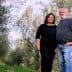 Orjana Hrvatin and Timotej Zupan standing together in an olive grove. - Olive Oil Times