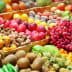 Colorful assortment of fresh fruits and vegetables arranged in baskets at a market. - Olive Oil Times