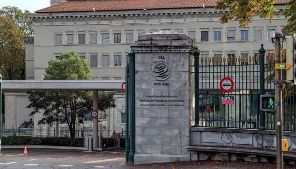 Entrance gate of the World Trade Organization headquarters in Geneva, Switzerland. - Olive Oil Times