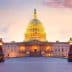 United States Capitol Building illuminated at sunset with a colorful sky in the background. - Olive Oil Times