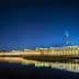 Night view of Parliament House in Canberra with reflections in the water. - Olive Oil Times