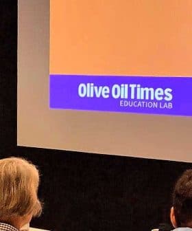 Speaker presenting at the Olive Oil Times Education Lab with an audience in attendance. - Olive Oil Times