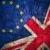 Close-up of the European Union and United Kingdom flags displayed together with a textured background. - Olive Oil Times