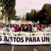 Group of people marching in a protest holding a large banner that reads 'Precios Justos Para Un Olivar'. - Olive Oil Times