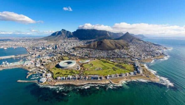 Aerial view of Cape Town featuring Table Mountain and the surrounding coastline. - Olive Oil Times