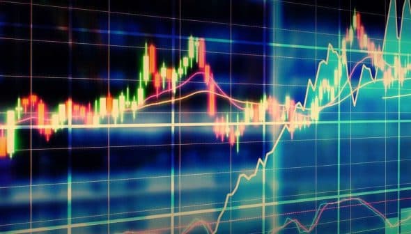 Colorful stock market chart displaying various graph lines and data trends on a digital screen. - Olive Oil Times