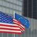 United States flag and European Union flag waving side by side on flagpoles. - Olive Oil Times