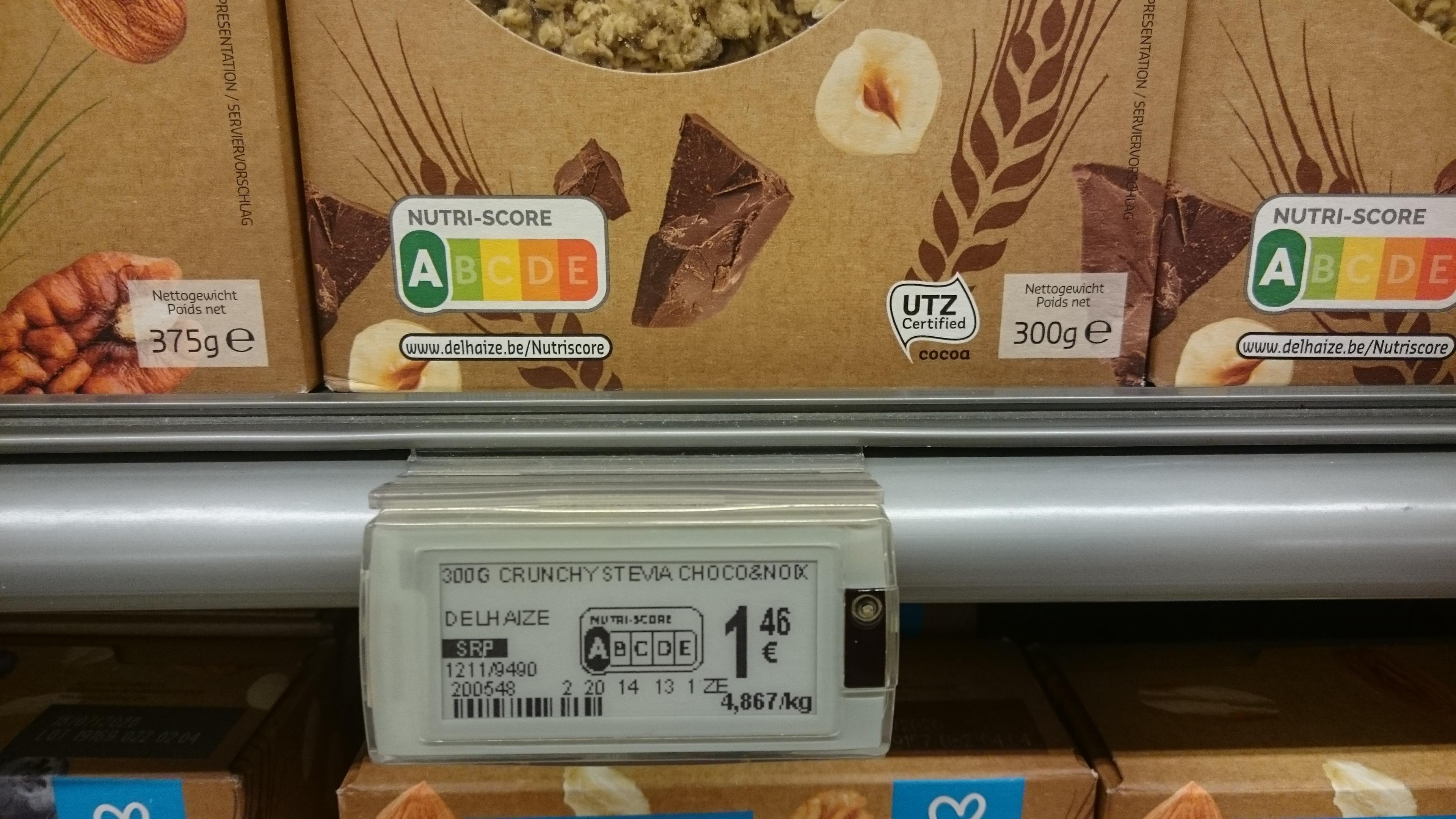 Product label for 300g Crunchy Chocolate Snack displayed in a grocery store. - Olive Oil Times