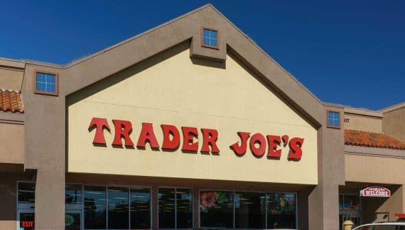 Exterior view of a Trader Joe's store with a prominent sign displaying the store name. - Olive Oil Times