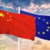 Chinese flag on the left and European Union flag on the right, both waving against a cloudy sky. - Olive Oil Times