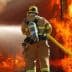 Firefighter in protective gear using a hose to extinguish flames from a burning structure. - Olive Oil Times