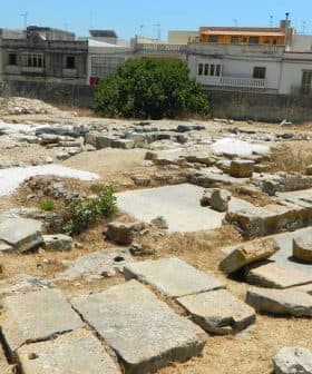 Excavated stone ruins at an archaeological site in Malta with visible structures and vegetation. - Olive Oil Times