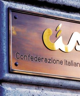 Bronze plaque displaying the logo and name of Confederazione Italiana Agricoltori. - Olive Oil Times