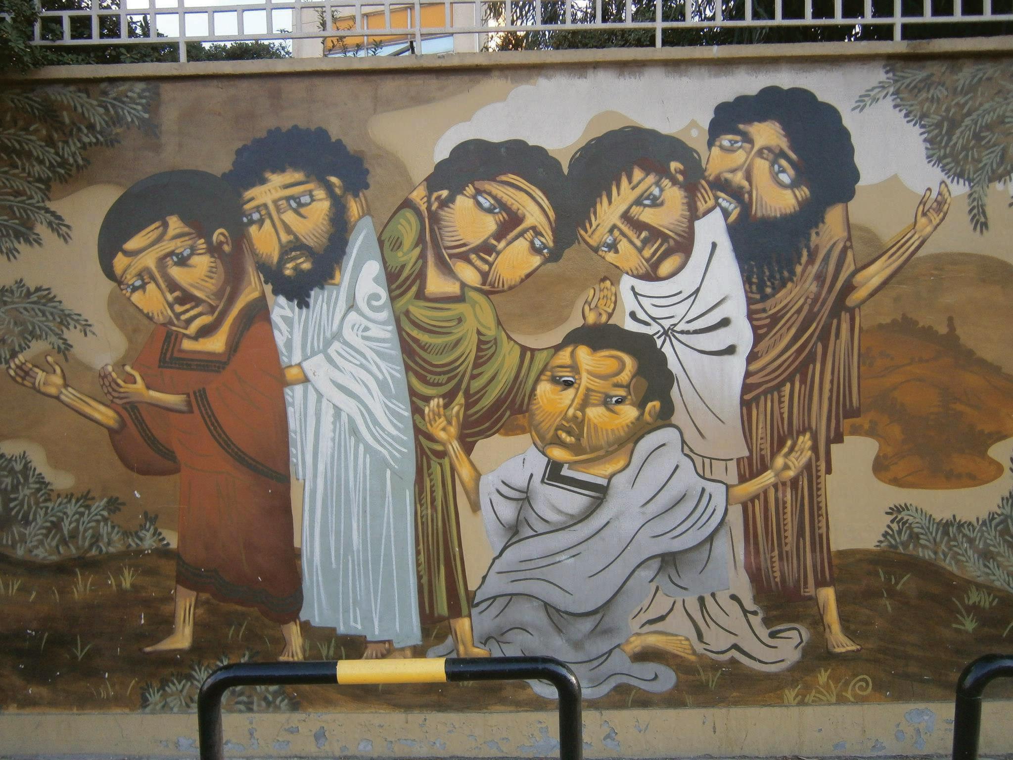 Mural featuring six figures in traditional attire with expressive faces and varied postures. - Olive Oil Times