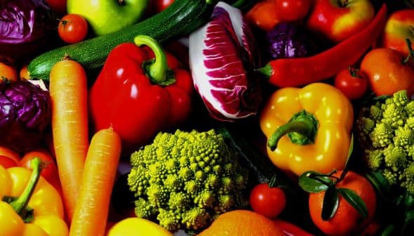 A variety of colorful vegetables and fruits including peppers, carrots, and broccoli. - Olive Oil Times