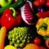 A variety of colorful vegetables and fruits including peppers, carrots, and broccoli. - Olive Oil Times