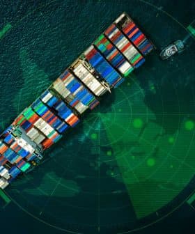 Aerial view of a cargo ship loaded with colorful containers on a radar screen. - Olive Oil Times