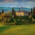 Stone house surrounded by cypress trees on a hill in a Tuscan landscape with rolling green fields. - Olive Oil Times