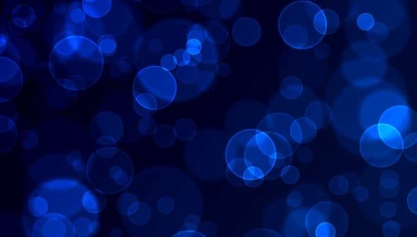 Abstract blue bokeh background with circular shapes and varying sizes. - Olive Oil Times