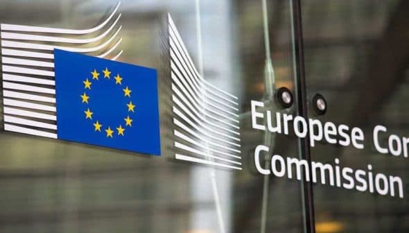 Signage of the European Commission featuring the EU flag and the organization's name. - Olive Oil Times