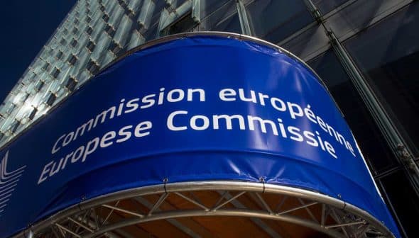 Signage displaying 'Commission européenne' and 'European Commission' on a building facade. - Olive Oil Times