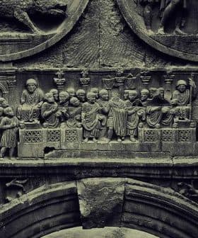 Detailed stone relief depicting historical figures and scenes in intricate carvings. - Olive Oil Times